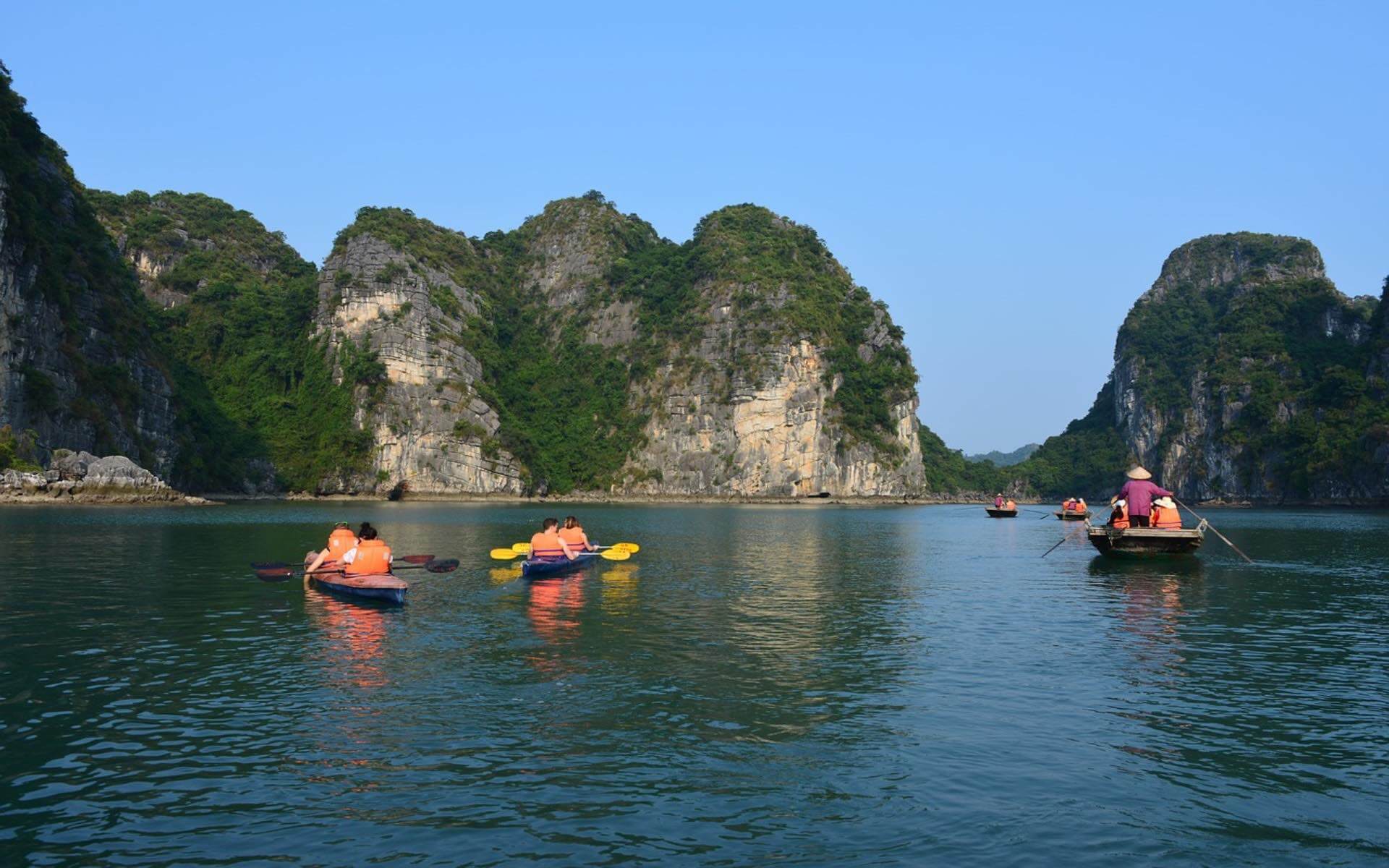 Active family holiday, kayaking across Halong Bay in Vietnam