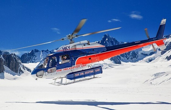 Helicopter landing on snowy mountain in August in New Zealand