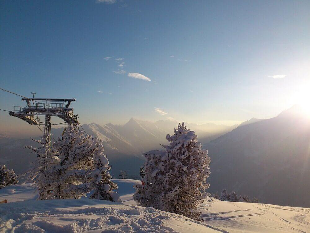 Snowy mountains and ski lift in July in New Zealand